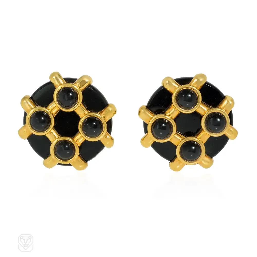Cipullo for Cartier onyx and gold disc-shaped earrings.