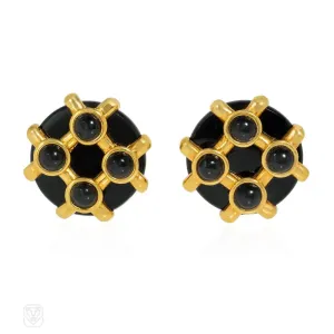Cipullo for Cartier onyx and gold disc-shaped earrings.