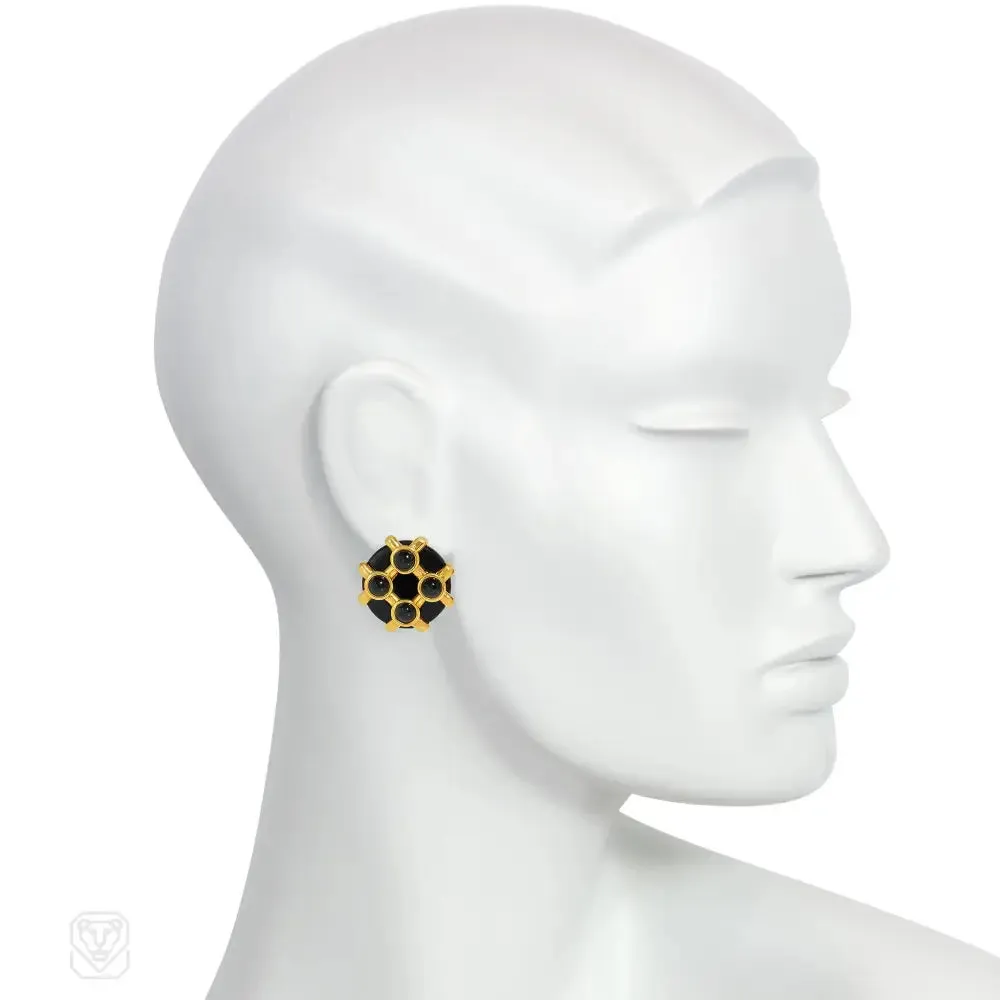 Cipullo for Cartier onyx and gold disc-shaped earrings.