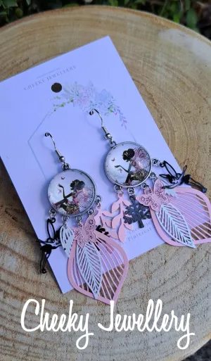 Flower fairy earrings. 
Light weight dangly earrings. so cute. Filigree earrings, dangly earrings.