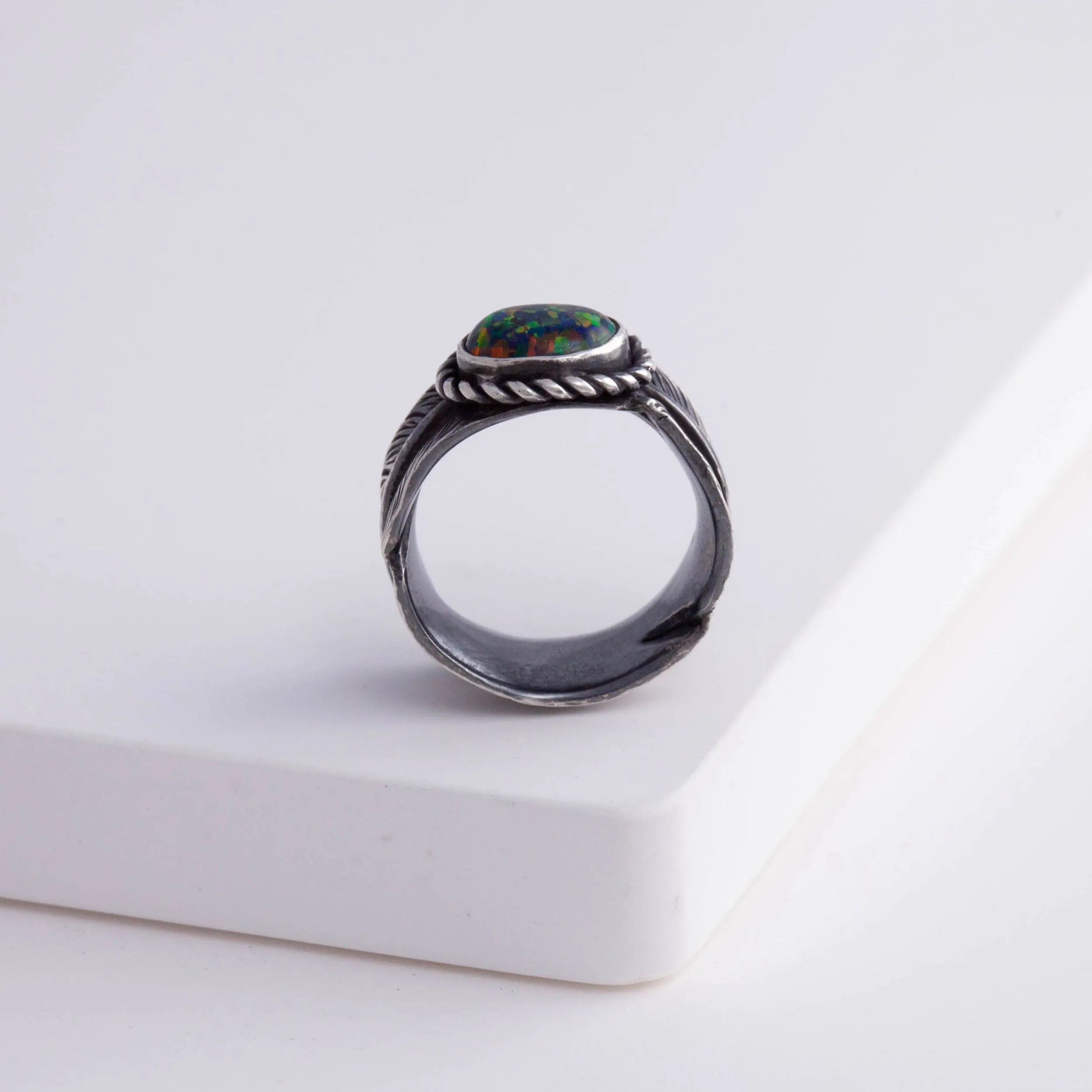 Oxidized silver large infinity feather ring with Kyocera opal