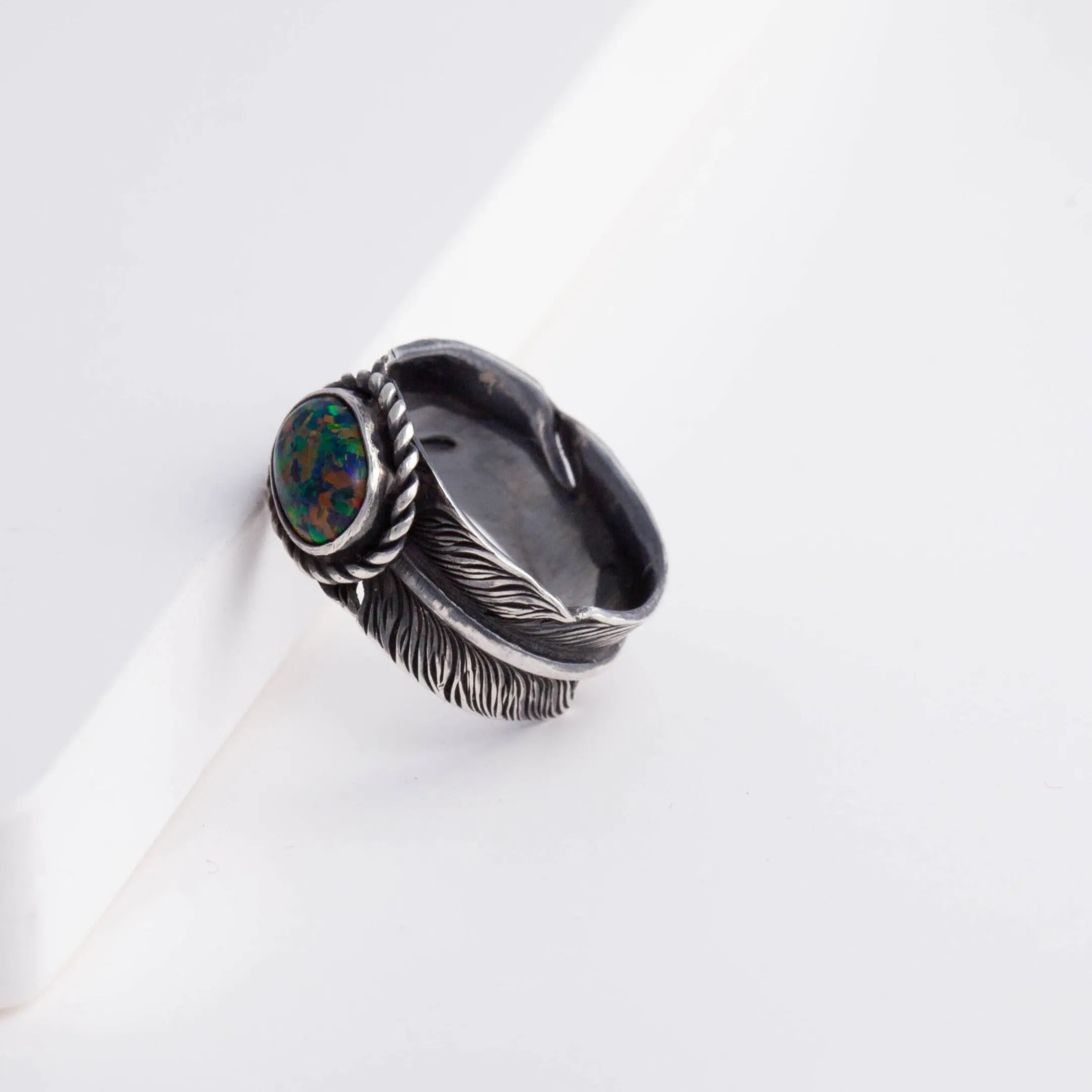 Oxidized silver large infinity feather ring with Kyocera opal