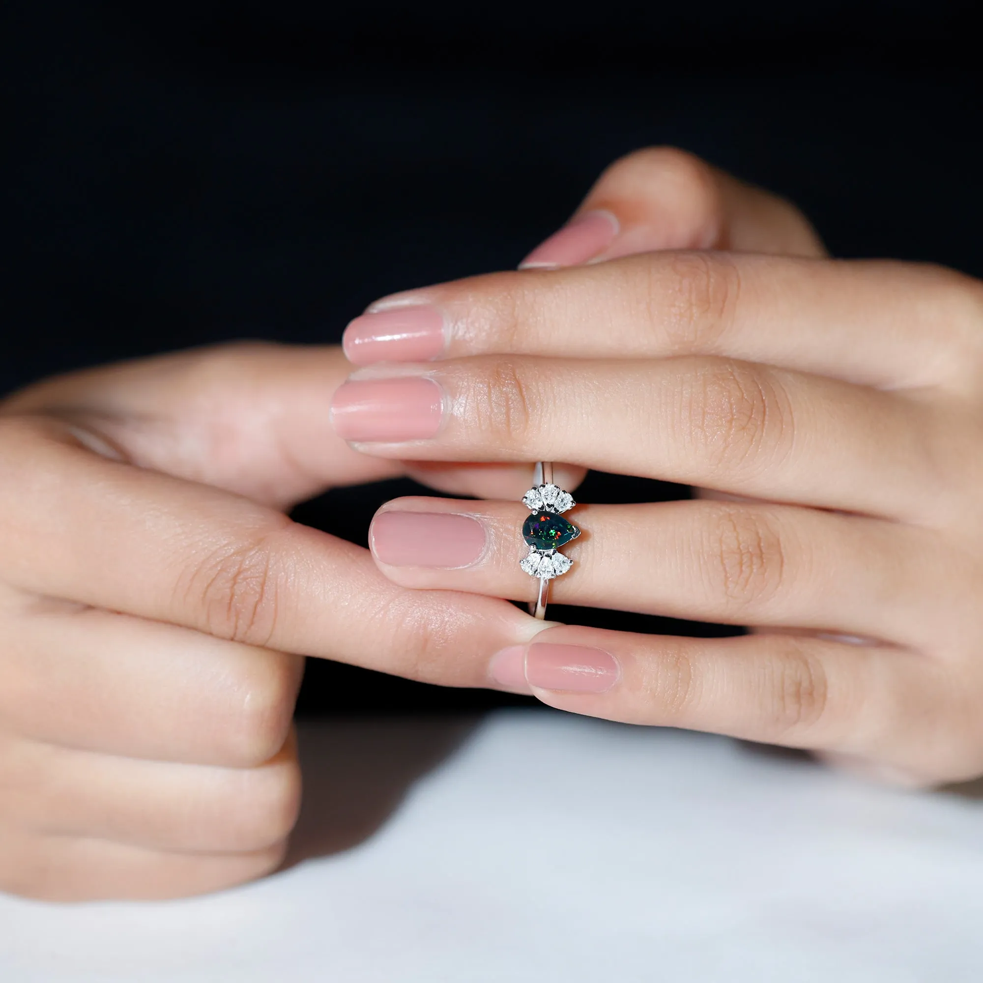 Pear Cut Black Opal Solitaire Engagement Ring with Diamond Trio
